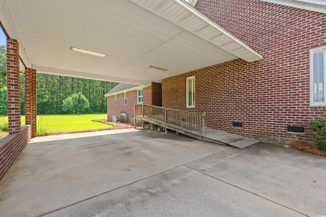 View of patio / terrace featuring a carport | Image 22
