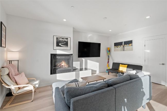 Living room with light hardwood / wood-style flooring | Image 10