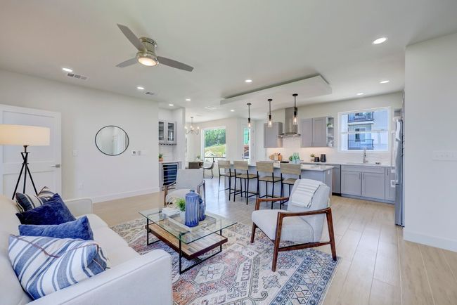 VIEW LOOKING TOWARD THE DINING ROOM. QUARTZ COUNTERTOPS IN KITCHEN IN ALL BATHROOMS AND BOSCH APPLIANCES INCLUDING REFRIGERATOR COME STANDARD IN ALL CONDOS | Image 12