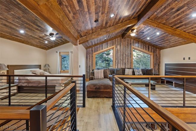 Bedroom featuring lofted ceiling with beams, wood ceiling, hardwood / wood-style floors, and recessed lighting | Image 22