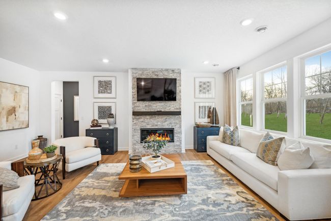 Photo is of the actual model. Cozy up next to the fireplace! | Image 7