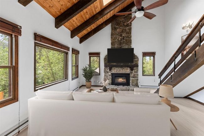 Living room with fireplace *Virtually Staged | Image 8