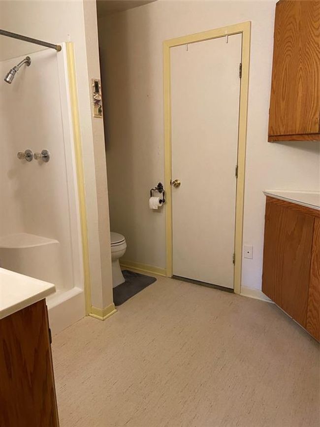 Large bathroom with shower & plenty of cabinets for storage | Image 27