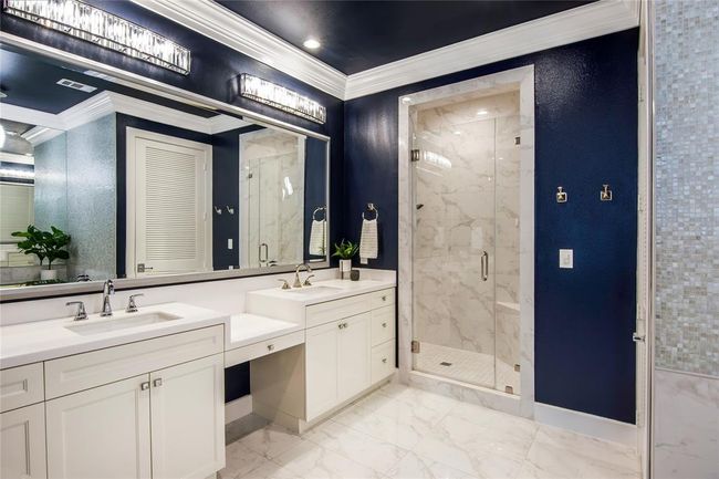 The primary en-suite is like walking into your personal spa! Large walk in shower, double sinks with plenty of storage! | Image 19