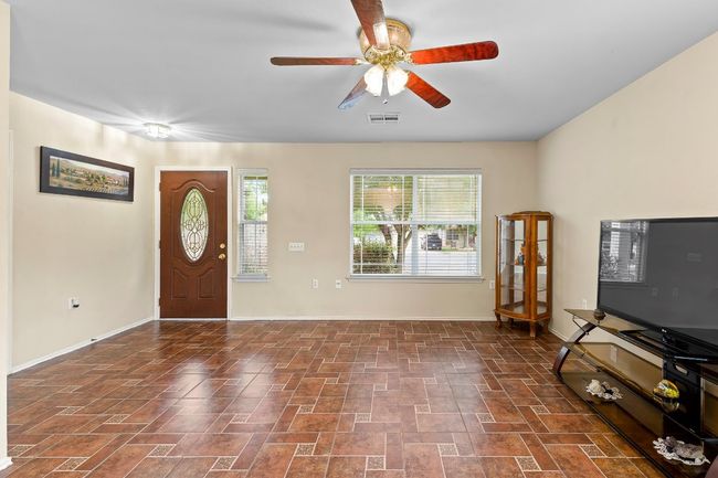 Living area with baseboards and ceiling fan | Image 8