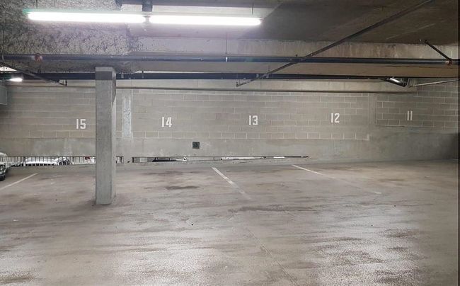 Garage featuring concrete block wall | Image 17