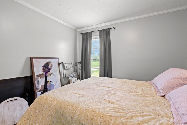 Bedroom with crown molding | Image 25