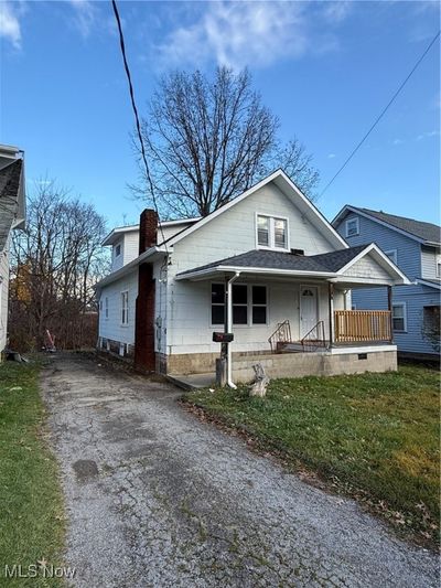 View of front of house with a front lawn and a porch | Image 1