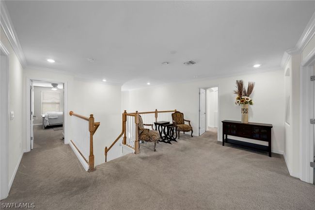 Living area featuring carpet floors and crown molding | Image 29