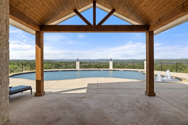 View of swimming pool featuring a patio area and a gazebo | Image 21