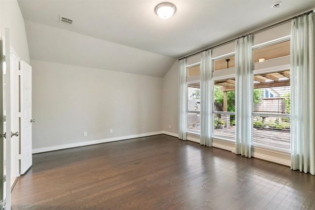 Primary Bedroom is Large and has Window Treatments and Blinds as well. | Image 14