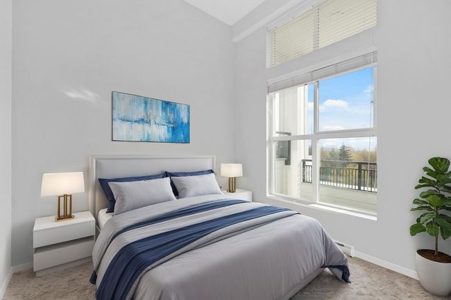 Bedroom with baseboards, carpet, and high vaulted ceiling | Image 15