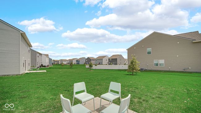 view of grassy yard with a residential view and cooling unit | Image 35