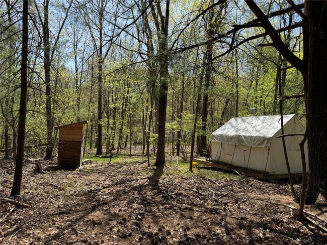 View of tent & bathroom shed | Image 6