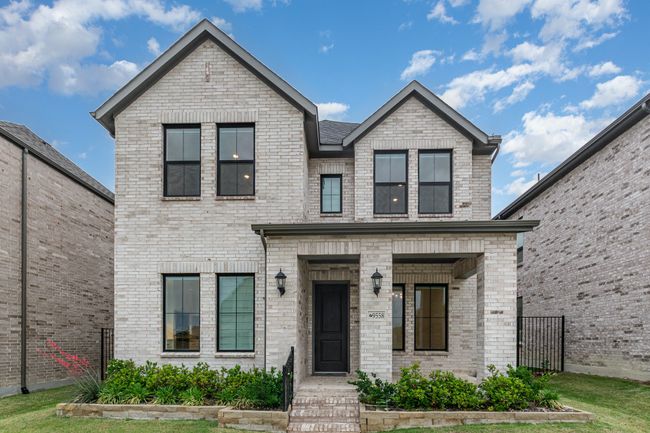 Contemporary home featuring brick siding | Image 4