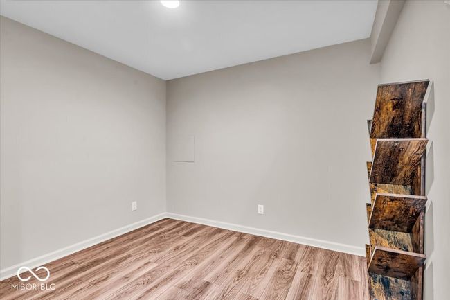 Side area in the basement with waterproof vinyl plank flooring, perfect for a play area, gym, office, etc. | Image 29