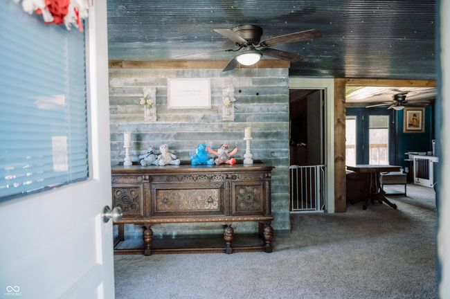 interior space with radiator and carpet | Image 34