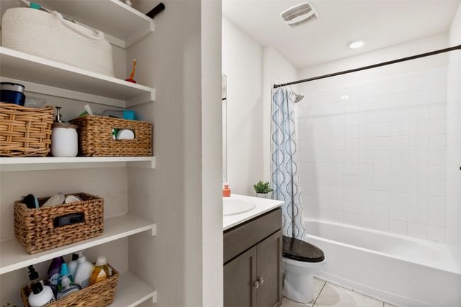 Full bath with tile patterned flooring, visible vents, toilet, vanity, and shower / bath combo | Image 27