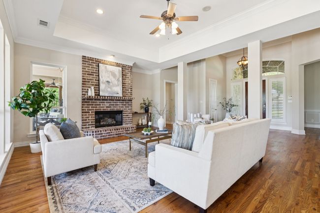 Another view of the living room showing the open flow of the space. | Image 9