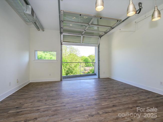 Cool garage door opening to balcony | Image 11
