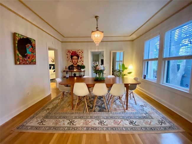 The dining room open up to the breakfast room and kitchen. | Image 12