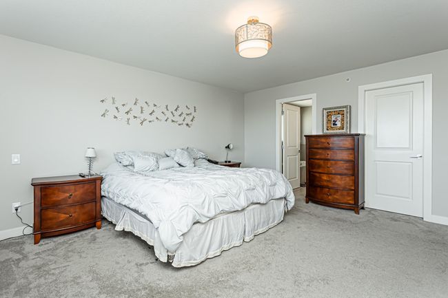 Carpeted bedroom featuring baseboards | Image 5