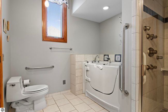 4173 Dornoch Ct, House other with 6 bedrooms, 4 bathrooms and null parking in Williamsburg MI | Image 59