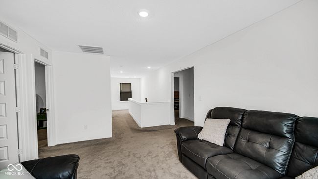 living room featuring carpet and baseboards | Image 23