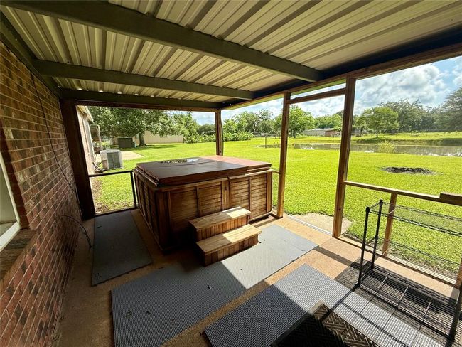 Covered back porch and hot tub | Image 23