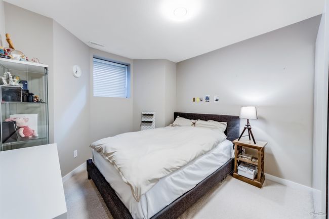 Carpeted bedroom with visible vents and baseboards | Image 26