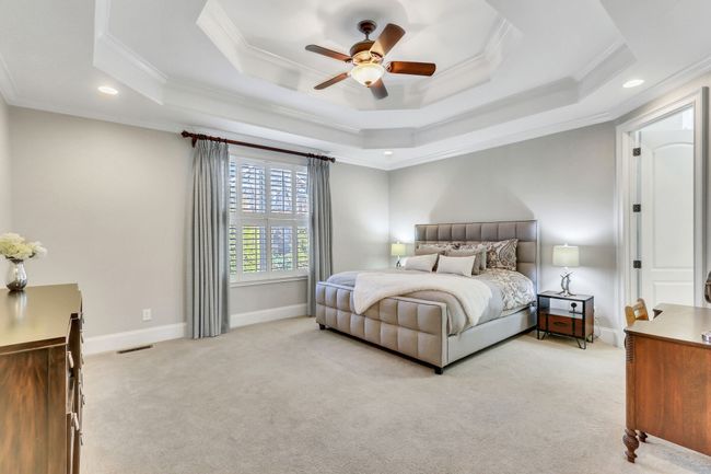 Grand primary suite on the main level with so much space! Double tray ceilings! | Image 28