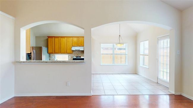 Kitchen brings in lots of natural sunlight with breakfast area. | Image 13