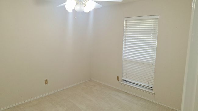 Spare room featuring light carpet and a ceiling fan | Image 24