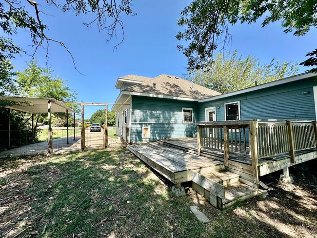 Back of house with a shingled roof and a deck | Image 28