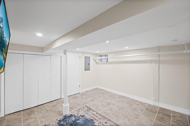 Basement featuring electric panel, tile patterned flooring, recessed lighting, and baseboards | Image 18