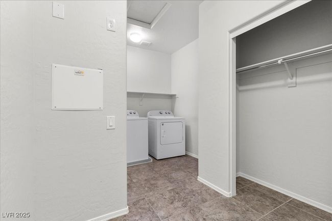 Washroom with independent washer and dryer, attic access, and tile patterned flooring | Image 31