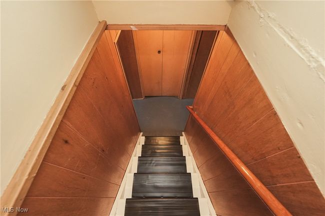Stairs featuring wood walls | Image 31
