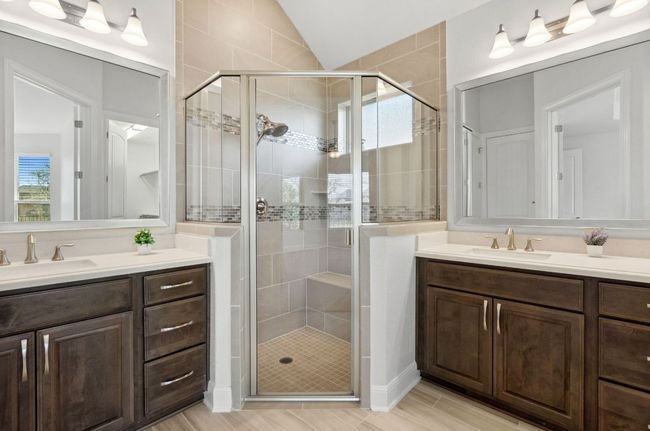 Bathroom with a stall shower, two vanities, and a sink | Image 22