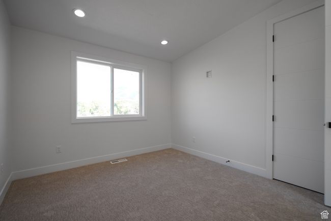 Carpeted empty room with baseboards and recessed lighting | Image 14