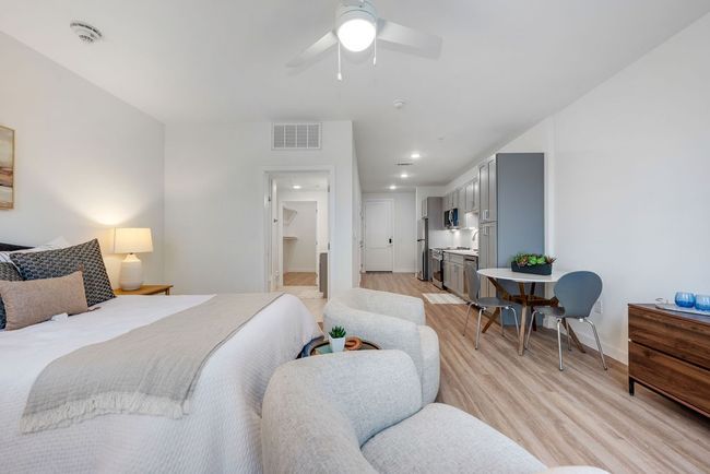Bedroom featuring light wood-style flooring, freestanding refrigerator, baseboards, recessed lighting, and ceiling fan | Image 12