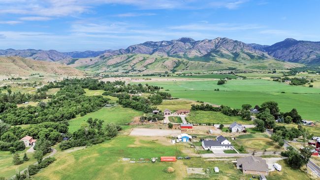 Aerial view of property's location with a mountainous background and rural landscape | Image 76