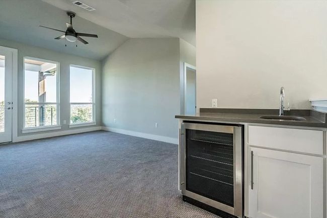 *BUILDER IDEA ONLY - NOT INCLUDED* The wet bar was initially offered by builder but owners chose cabinetry (shown in previous image) for their growing family. It is wired if buyer opted to update for their lifestyle needs. | Image 17