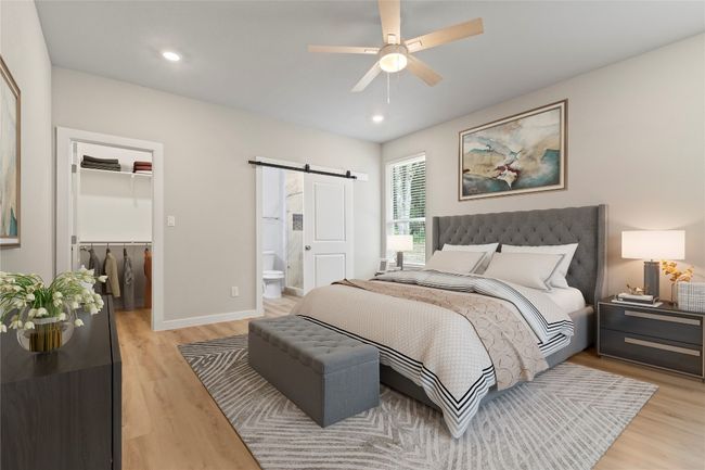 A stunning primary bedroom with abundant natural light, a spacious layout, a luxurious bath and shower, and ample closet space—designed for comfort and elegance. (virtually stage) | Image 16