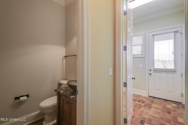 First floor half bath, laundry | Image 35