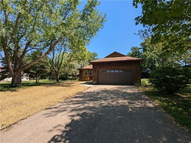 View of front of home featuring an attached garage and driveway | Image 8