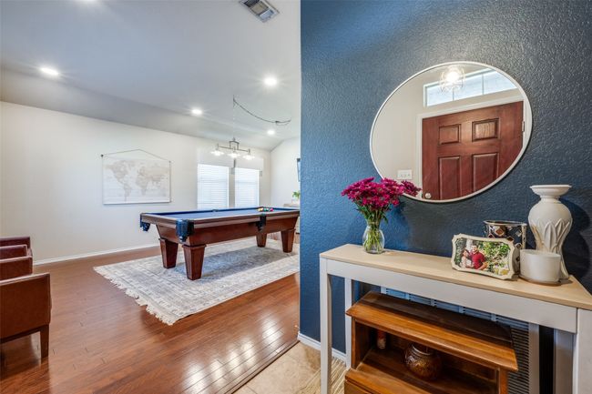 Rec room featuring pool table, wood finished floors, recessed lighting, and a chandelier | Image 4