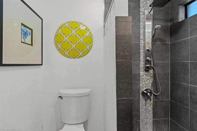 Primary bath features an updated walk-in shower | Image 17