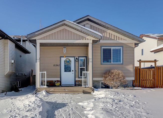 11262 75a Avenue, Home with 4 bedrooms, 2 bathrooms and 3 parking in Grande Prairie AB | Image 1