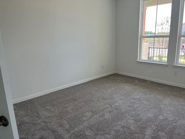 Carpeted empty room featuring plenty of natural light and​​‌​​​​‌​​‌‌​‌‌​​​‌‌​​‌‌​‌​​​​​‌ baseboards | Image 5