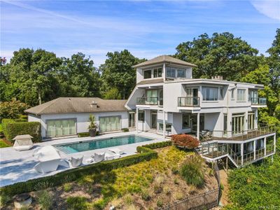 Back of house with a balcony and a patio | Image 1